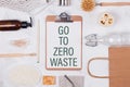 Natural bath and kitchen accessories on white background and text Go To Zero Waste. Royalty Free Stock Photo