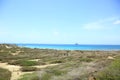 Natural beauty of Aruba. North coast. Off-road Aruba. Amazing stone desert landscape, blue sea and blue sky. Royalty Free Stock Photo