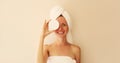 Natural beauty portrait of happy smiling young caucasian woman touches her clean skin while drying wet hair with white wrapped Royalty Free Stock Photo