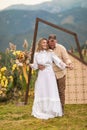 natural beauty and simplicity of a couple who eloped in the mountains surrounded by natural decor and flowers. The bride is