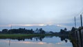 The natural beauty of the sky and the water of the pond have merged together in the village of Hemayetpur Pabna Royalty Free Stock Photo