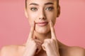 Natural beauty. Young woman applying lip balm