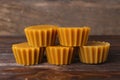 Natural beeswax cake blocks on wooden table, closeup