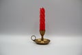 Natural beeswax candle in metal holder. Ceremonial candle. Red candle. Candles for spa, relaxation or bath