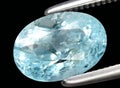 Natural blue aquamarine beryl gem on the background Royalty Free Stock Photo