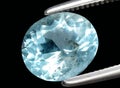 Natural blue aquamarine beryl gem on the background Royalty Free Stock Photo
