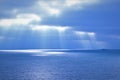 Natural blue background - sea, sky, clouds, sun fingers Royalty Free Stock Photo