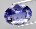 natural blue iolite gem on the background Royalty Free Stock Photo