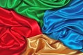 Natural blue, red, golden and green satin fabric texture Royalty Free Stock Photo