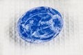 Natural blue soap bar and bubble foam on bath towel background