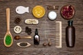 Natural body and hair care cosmetics on wood background. Spa products and accessories. Top view, flat lay