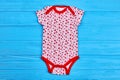 Natural bodysuit for newborn girl.