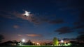 Natural Bold Bright Blue Sky Background. Night Starry Sky With Glowing Stars Above Countryside Landscape. Time Lapse