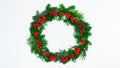 Natural branches of spruce and arborvitae are decorated with red rowan berries. Eco friendly Christmas wreath