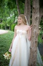 Natural bride against a tree