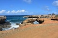 Natural Bridge by Black Stone Beach in Aruba Royalty Free Stock Photo