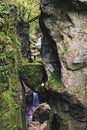 A natural bridge created by a fallen rock that got stuck between the walls of the gorge