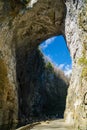 Visitors Under the Arch at Natural Bridge State Park, Virginia, USA Royalty Free Stock Photo