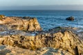 Sunlit Rocks at Natural Bridges State Beach Royalty Free Stock Photo