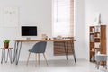 Natural and bright office of a start-up company with wooden furn Royalty Free Stock Photo