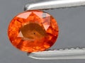 natural bright orange sapphire gem on the background Royalty Free Stock Photo