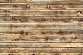 Natural brown barn wood wall. Wooden textured background pattern. Royalty Free Stock Photo