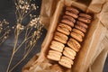 Natural brown, beige and cream colored French macarons with coffee, mocha, chocolate and vanilla flavorpaper Royalty Free Stock Photo