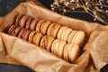 Natural brown, beige and cream colored French macarons with coffee, mocha, chocolate and vanilla flavour Royalty Free Stock Photo