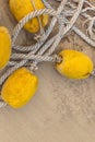 Natural canvas rope old and weathered with strung yellow buoys Royalty Free Stock Photo