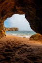 Natural cave in the Algarve on the beach at Praia da Coelha, Albufeira, Portugal Royalty Free Stock Photo