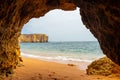 Natural cave in the Algarve on the beach at Praia da Coelha, Albufeira, Portugal Royalty Free Stock Photo