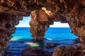 Natural cave on the coast in Spain, Moraira, Alicante, Cova dels Arcs Royalty Free Stock Photo