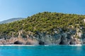 Natural caves along the coastline in Cala Luna, famous bay in the Orosei gulf Sardinia, Italy Royalty Free Stock Photo