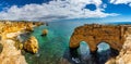 Natural caves at Marinha beach, Algarve Portugal. Rock cliff arches on Marinha beach and turquoise sea water on coast of Portugal Royalty Free Stock Photo