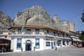 natural caves for monks in the rock formations of Meteora above the Greek white houses of Kastraki, Kalabaka, Greece Royalty Free Stock Photo