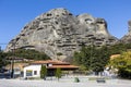 Natural caves for monks in the rock formations of Meteora above the houses of Kastraki, Kalabaka, Greece Royalty Free Stock Photo