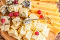 Natural cheeses slices, side view. Pieces cheese on natural background.