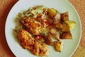 A natural chicken steak with potatoes on ceramic plate