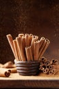 Natural cinnamon sticks and powder on brown dust background. Aromatic spice. Royalty Free Stock Photo