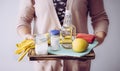 Natural cleaners concept. Woman holding eco friendly home cleaning ingredients, white vinegar, lemon, baking soda, citric acid con Royalty Free Stock Photo