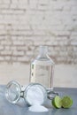 Natural cleaning products, including sodium bicarbonate, invert jar, baking soda, lemon, vinegar,on grey table on old Royalty Free Stock Photo