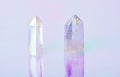 Natural clear crystal quartz electroplating rainbow on holographic background. Meditation, reiki and spiritual healing concept Royalty Free Stock Photo