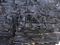 Natural coal seam above ground on a coastal headland Newcastle NSW Australia Royalty Free Stock Photo