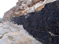 Natural coal seam above ground on a coastal headland Newcastle NSW Australia Royalty Free Stock Photo