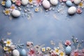 Natural colorant painted eggs on blue concrete table with floral elements, happy Easter celebration, top view, copy