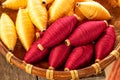 Natural colour of red and yellow cotton spools of thread use for weaving textile with tradition loom Royalty Free Stock Photo