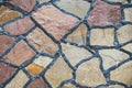 Natural coloured stone block paving texture. Stone wall with black seams. Building background Royalty Free Stock Photo