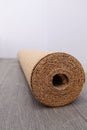 Natural cork substrate on the floor with laminate Royalty Free Stock Photo