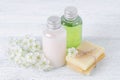 Natural cosmetic bottle and handmade soap bar with fresh flowers Royalty Free Stock Photo