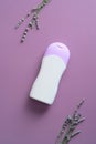 Natural cosmetic bottle mockup with lavander on purple background. Herbal beauty product container design